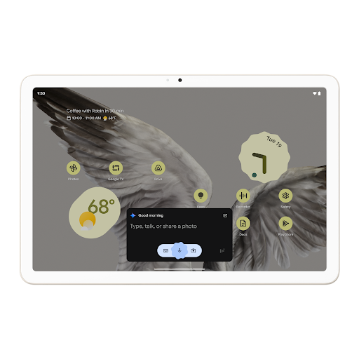 A tablet home screen displaying a Gemini AI search box to type, talk or share a photo.