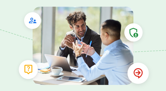 Two people having a meeting over coffee with a laptop and a tablet.