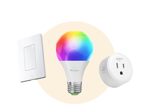 White plate light switch next to a rainbow lightbulb and a smart plug