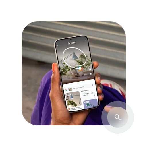 A hand holding a phone with the screen showing an abstract example of how the Circle to Search feature works.