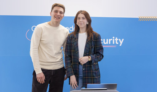 A man and woman posing for picture.