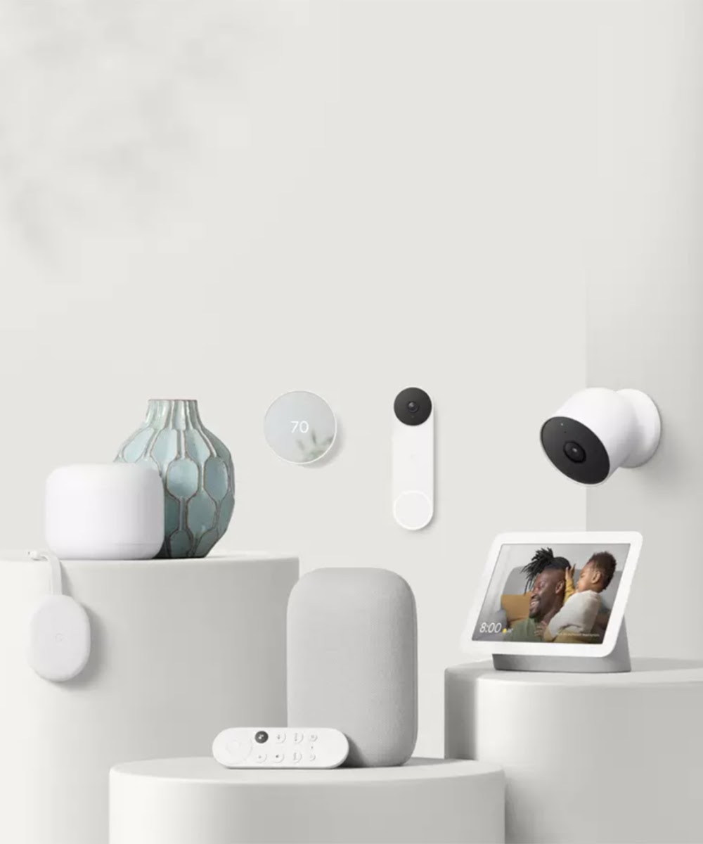 Display of various Google Nest smart home devices, including Nest doorbell, Nest Wifi, Nest Cam, Nest Thermostat, Chromecast with Google TV, Nest Audio and Nest Hub.