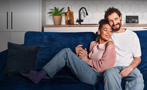 Image of couple enjoying the features of Google Home within their house