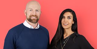Cofounders Peter Fish and Shardi Nahavandi smile at a camera against a pink backdrop.